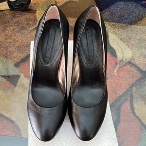 Black leather pumps